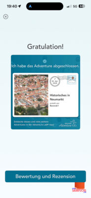 Smartphone-Display mit der Erfolgsmeldung des abgeschlossenen Lab Adventures